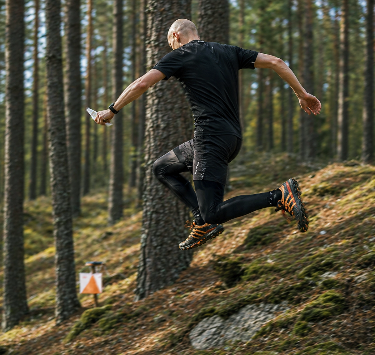Runner choosing a route through the forest