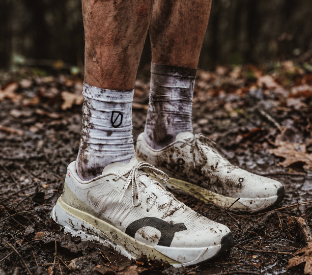 Mud-covered running shoes